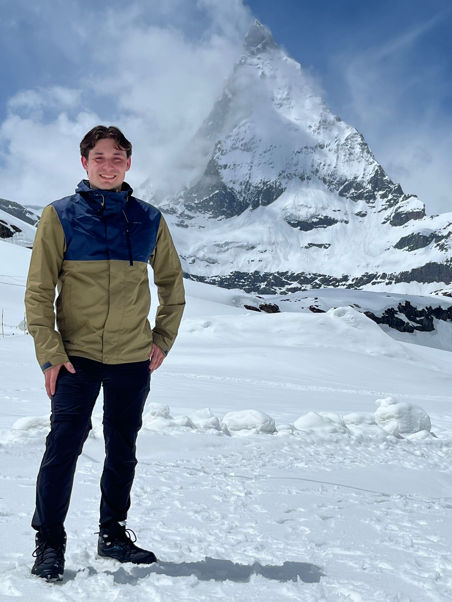 Me at the top of matterhorn in front of the peek on a sunny misty day